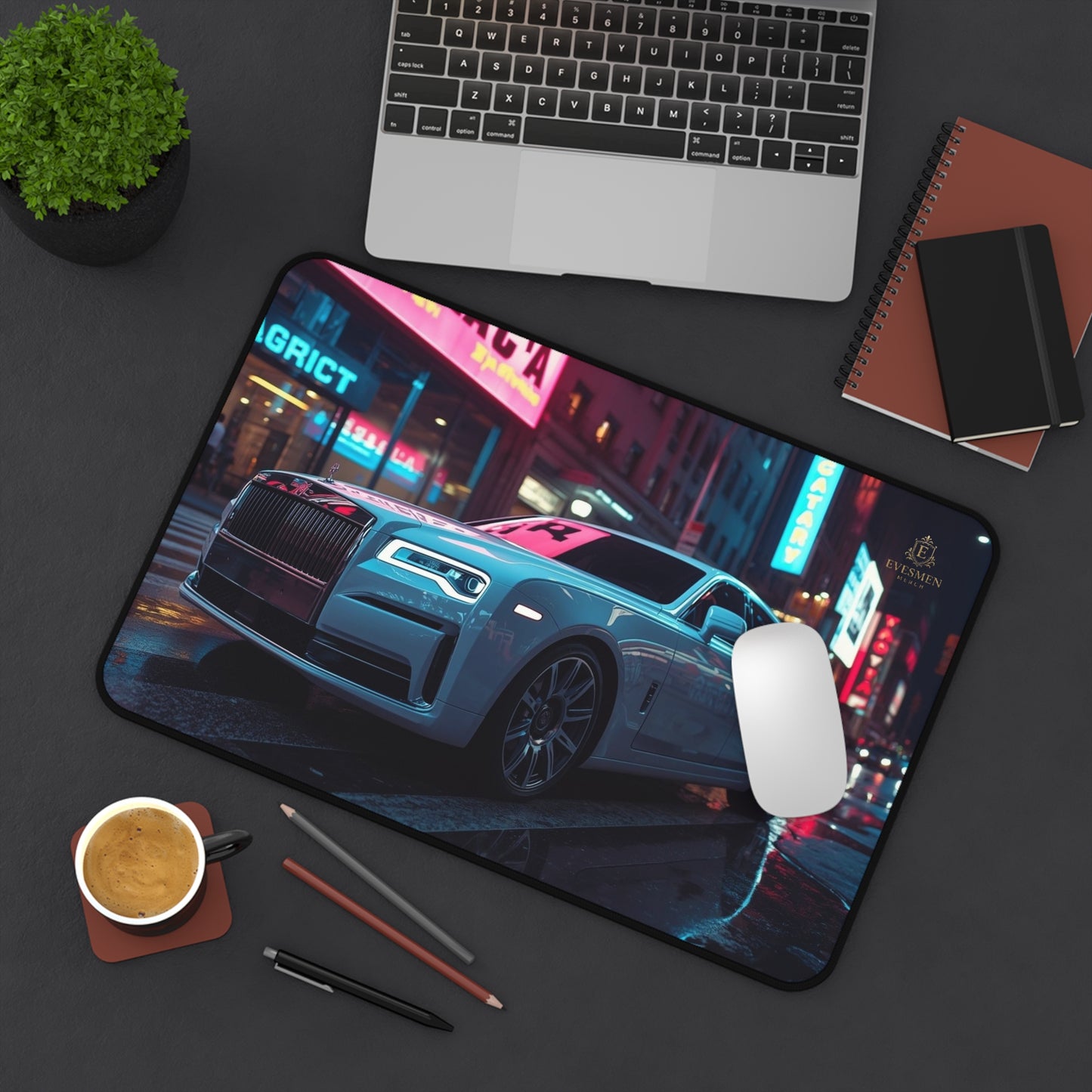 Mouse pad with car design on a desk with laptop, mouse, and coffee.