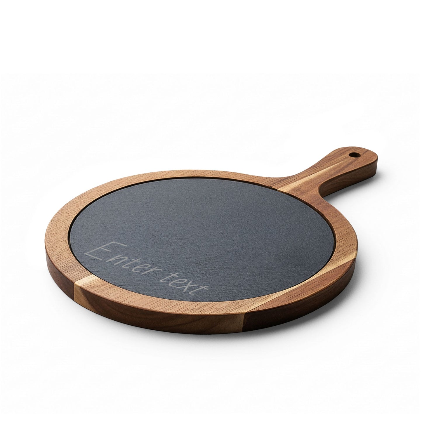 Round wooden cutting board with a black slate surface on a white background