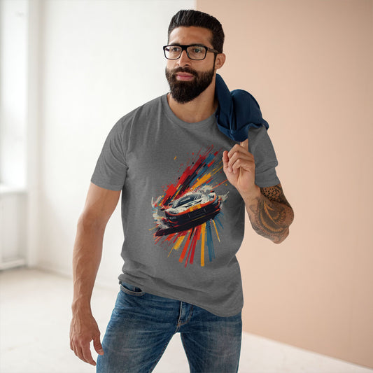 Man wearing a gray t-shirt with a colorful graphic design in a minimal indoor setting