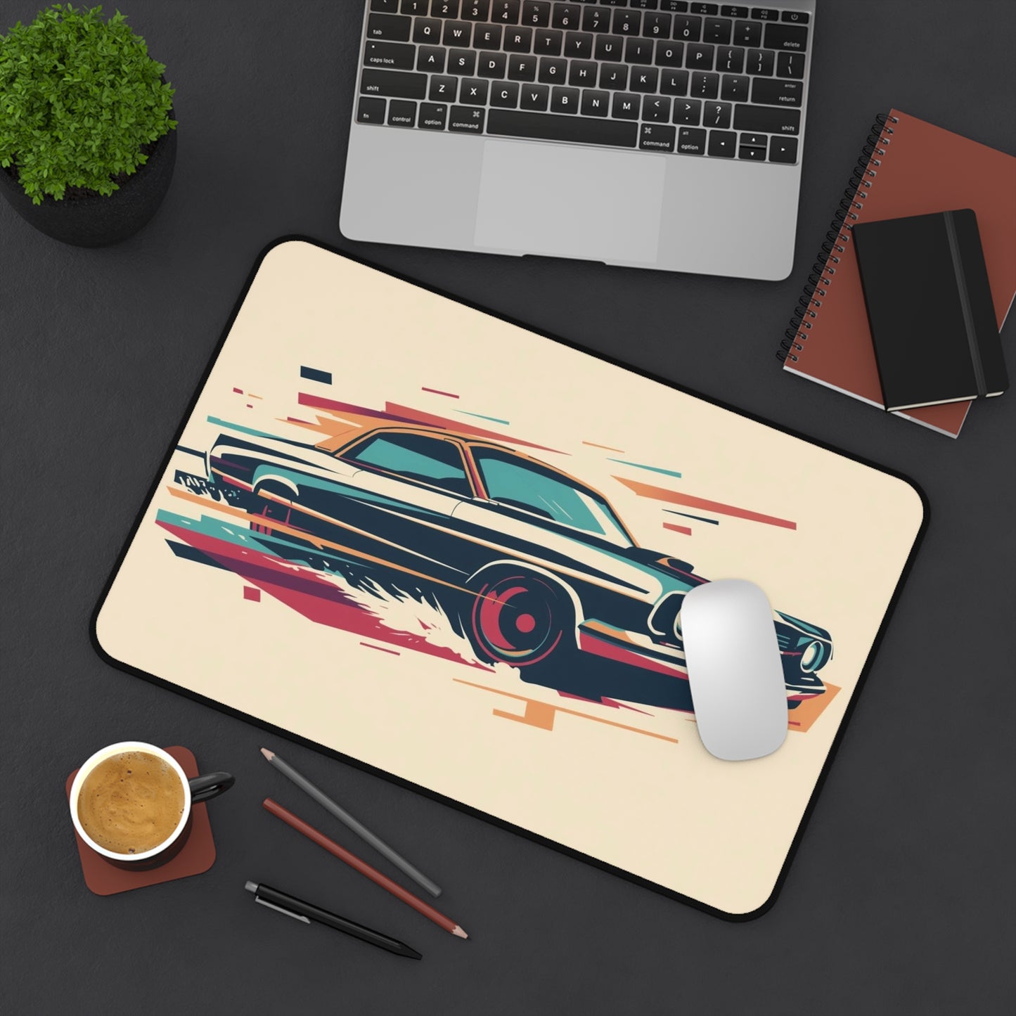 Desk setup with a mousepad featuring a car design, laptop, mouse, coffee, and stationery items.