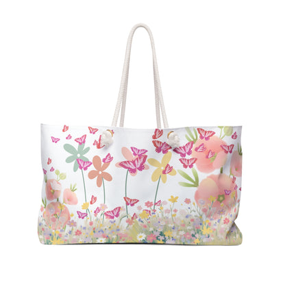 Floral patterned bag with pink flowers and butterflies on a white background