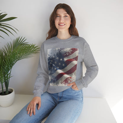 Woman wearing a gray sweatshirt with a vintage American flag design, sitting in a room with a plant.