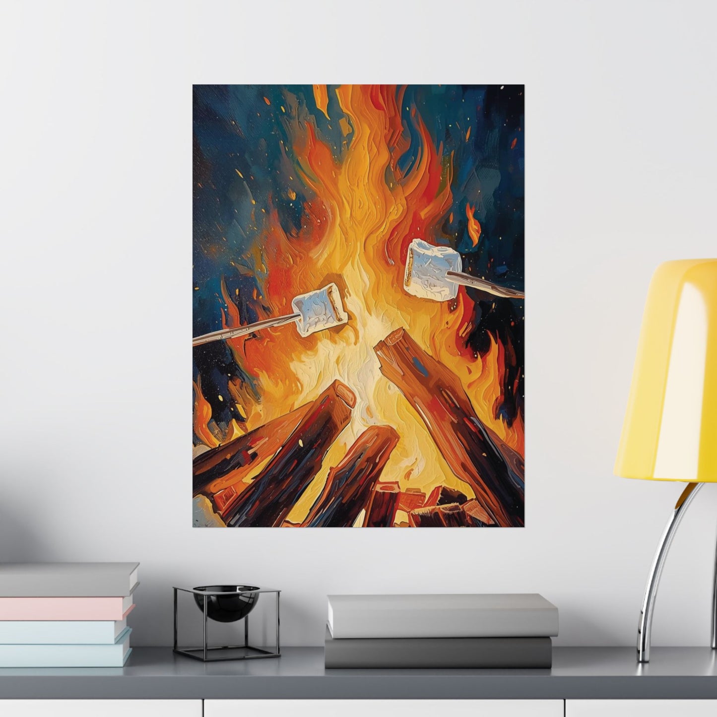 Framed artwork of marshmallows roasting over a campfire on a wall above a shelf.