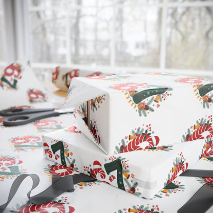 Gift box wrapped in festive paper with candy cane design, scissors on a matching surface.
