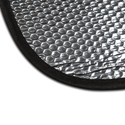 Close-up of a textured silver mat with black border on a white background