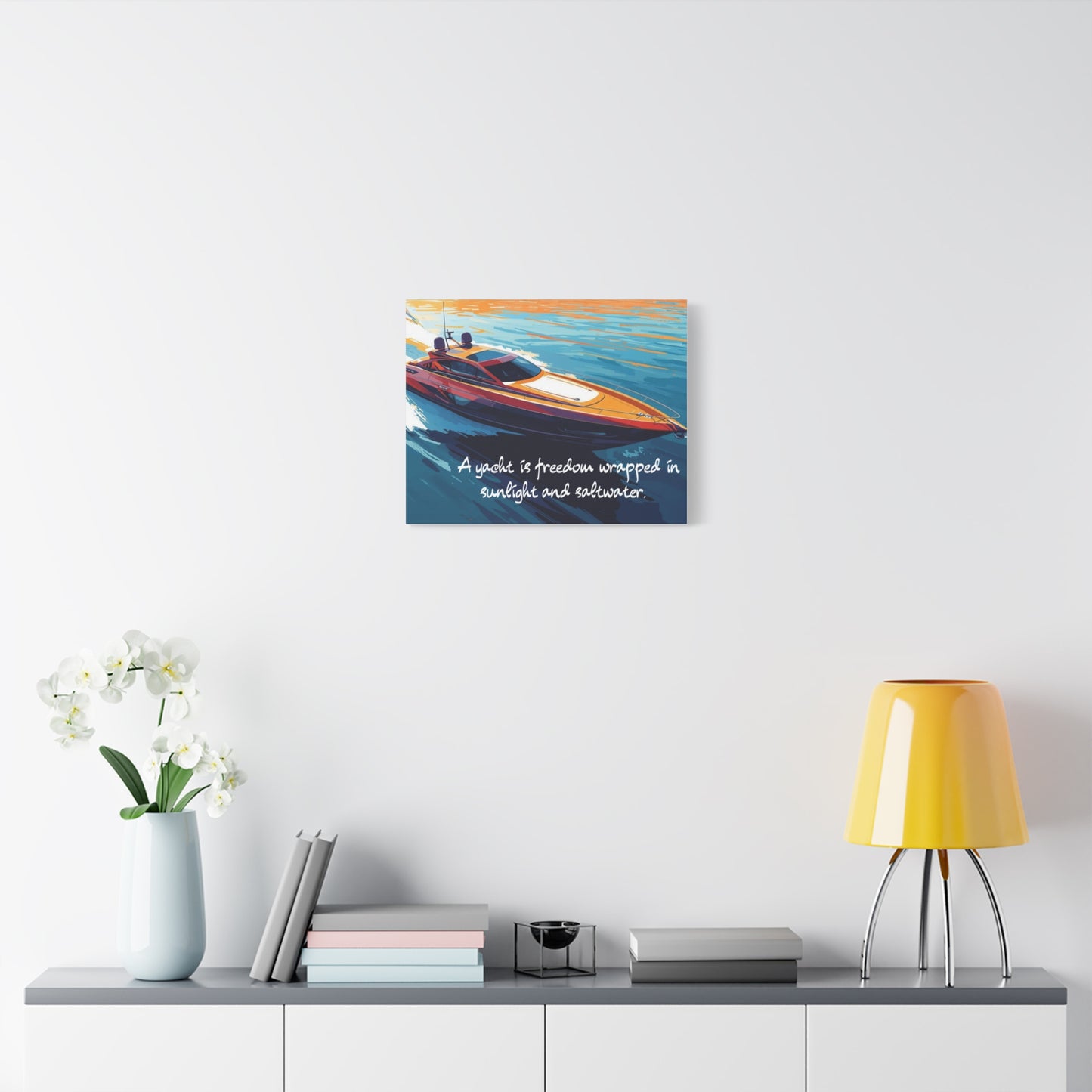 Yacht canvas wall art with a quote above a shelf with decor items.