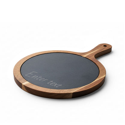 Round wooden cutting board with a black slate surface on a white background