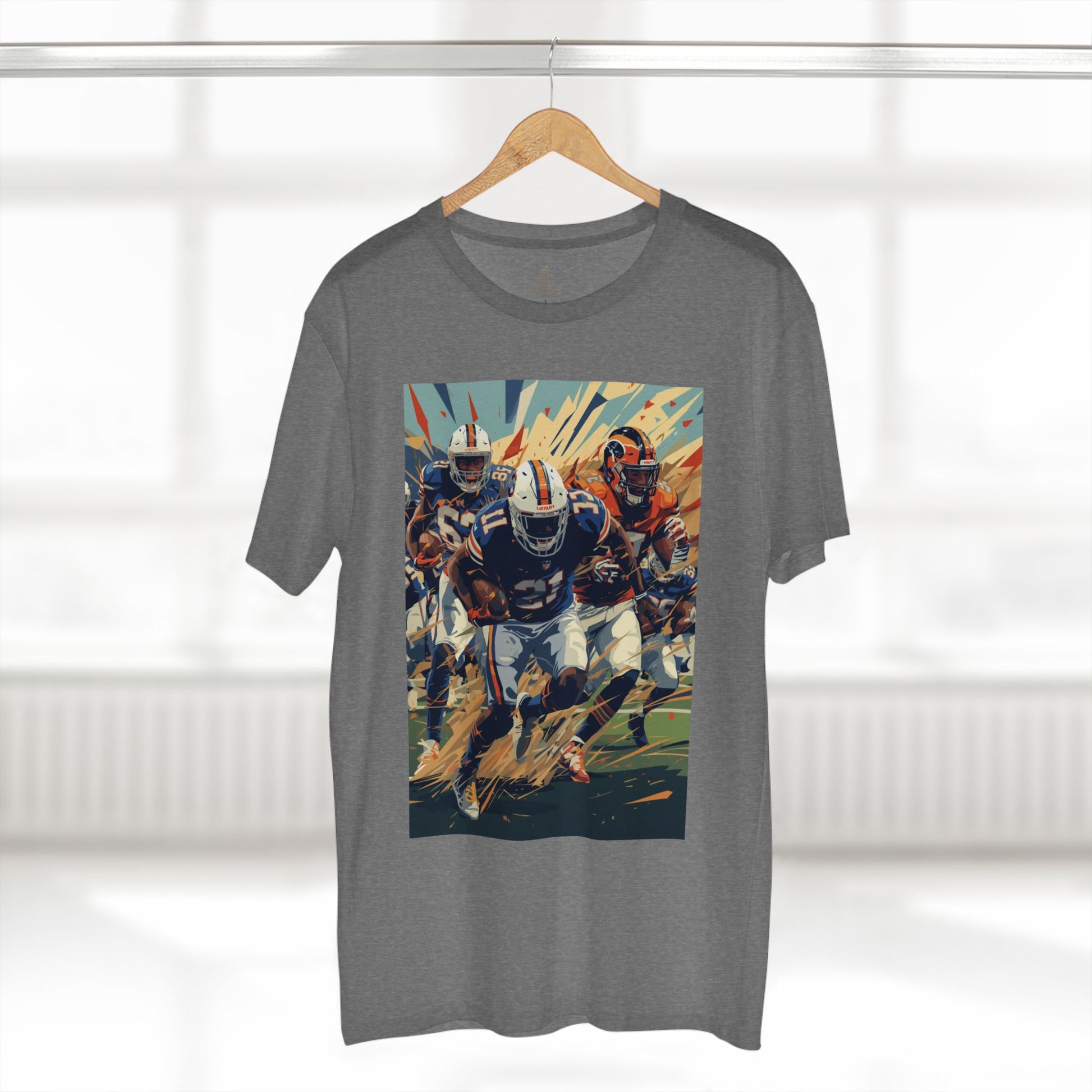 Gray t-shirt with a colorful graphic of football players on a hanger against a white background