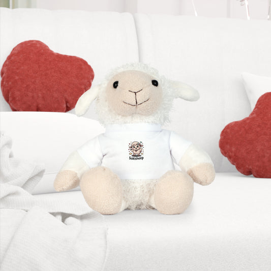 White stuffed lamb toy with a logo on a white surface with red heart-shaped cushions.