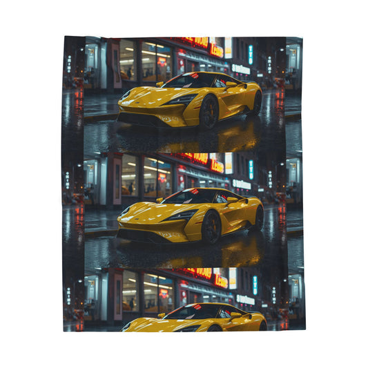 Yellow sports car on a reflective city street at night