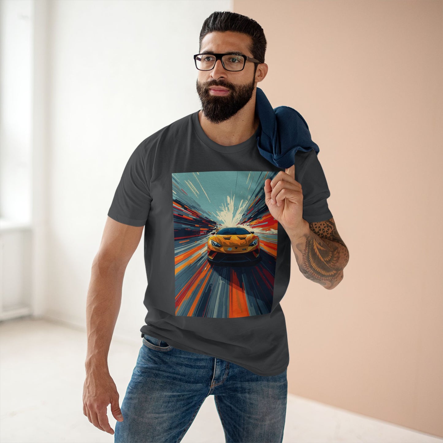 Man wearing a t-shirt with a colorful car graphic design.