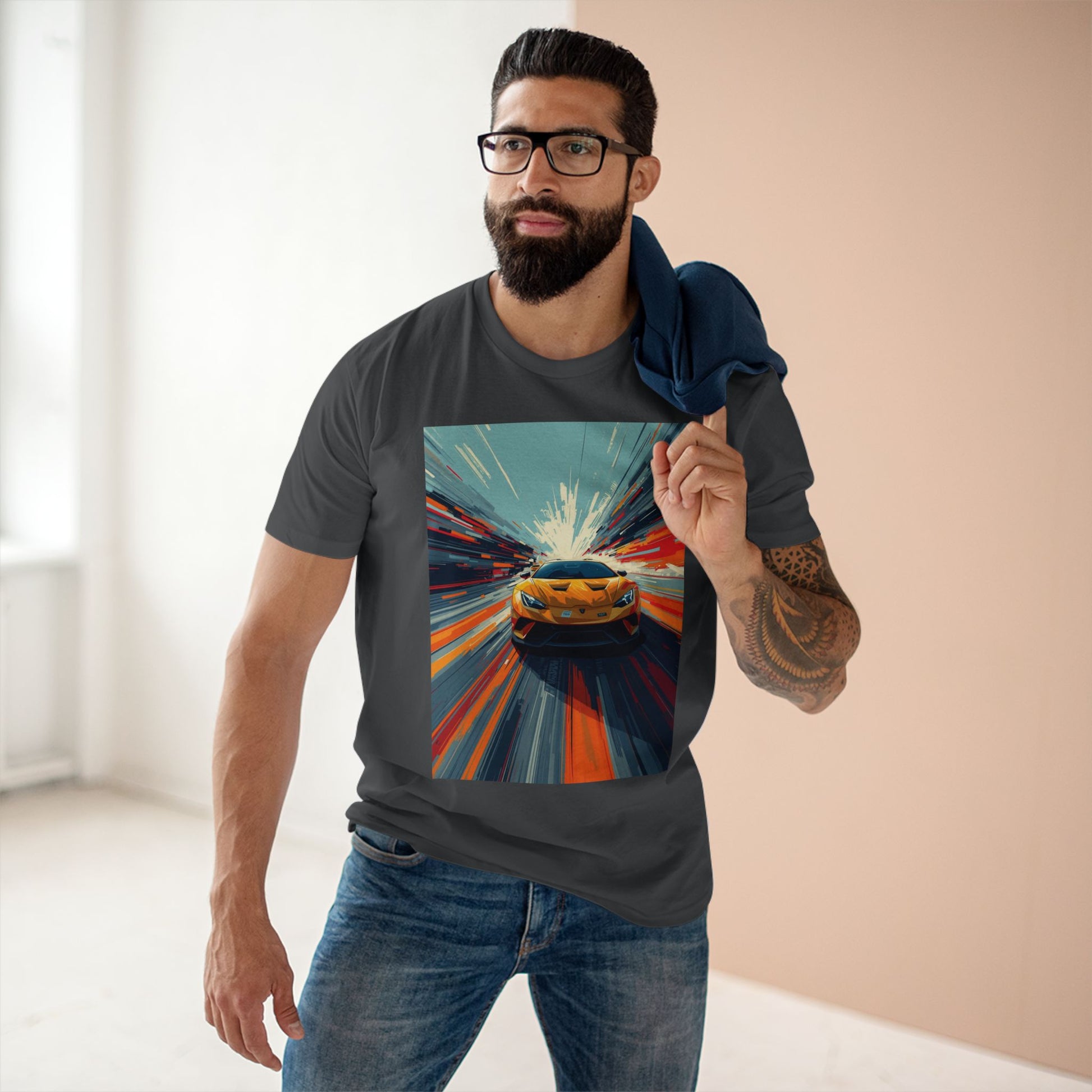 Man wearing a t-shirt with a colorful car graphic design.