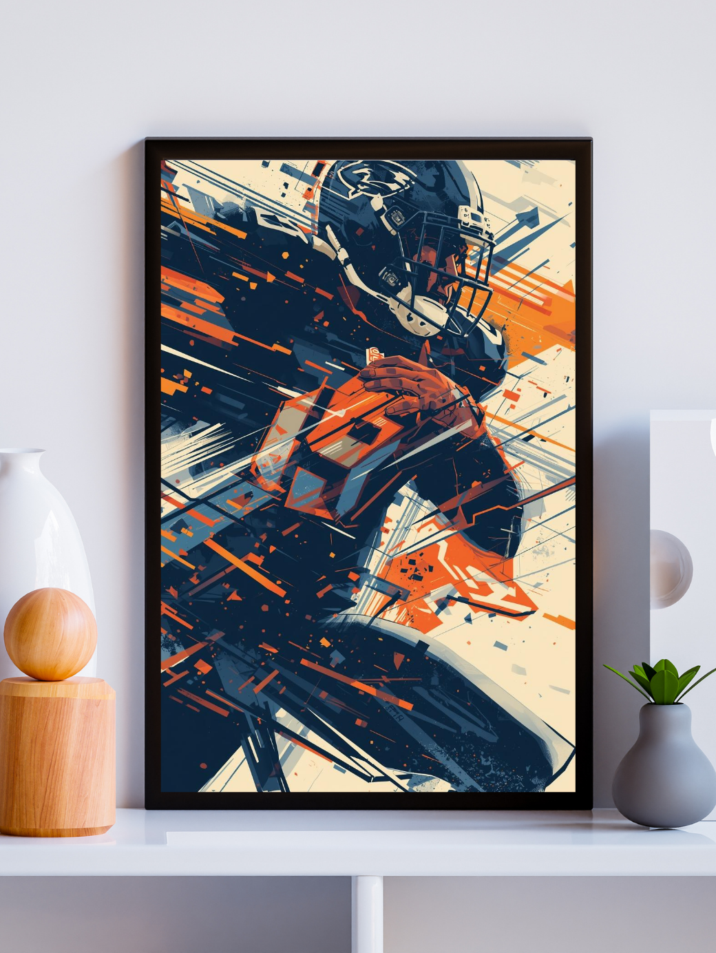 Framed artwork of a football player in action on a white wall.