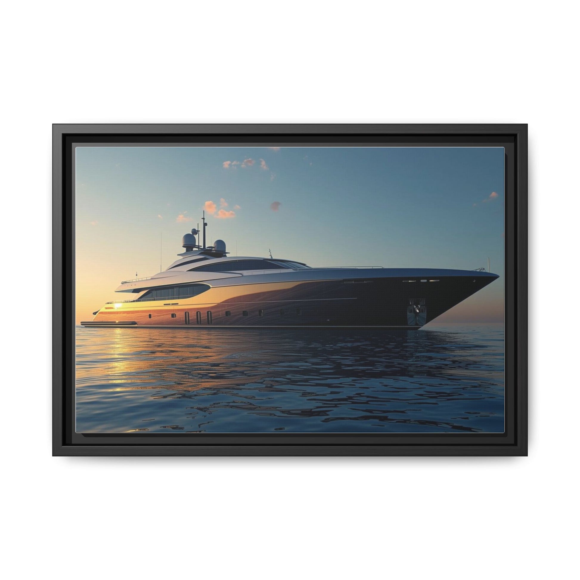 Framed photograph of a luxury yacht on the water with a sunset sky.