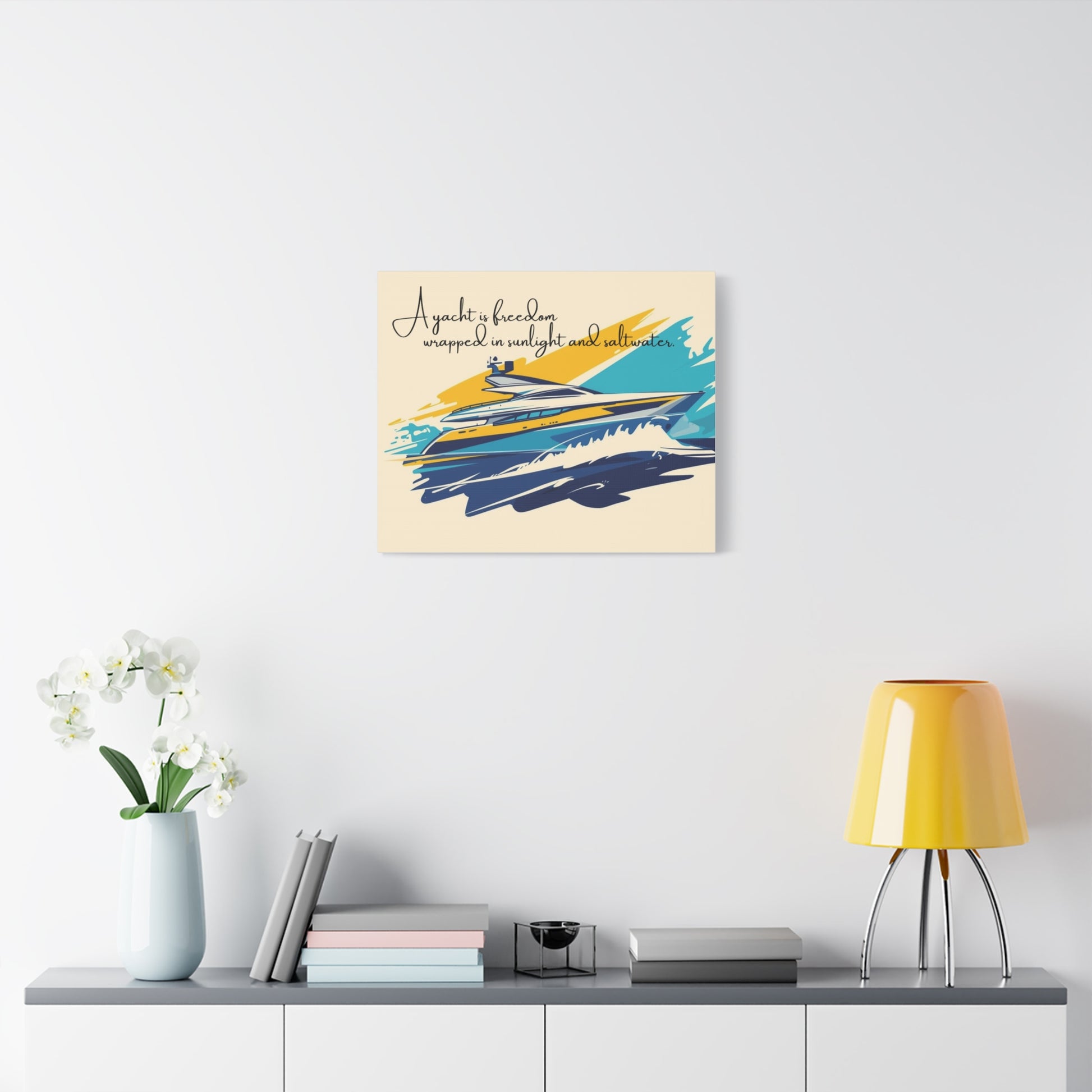 Decorative wall art canvas on a white wall above a shelf with books and a lamp.