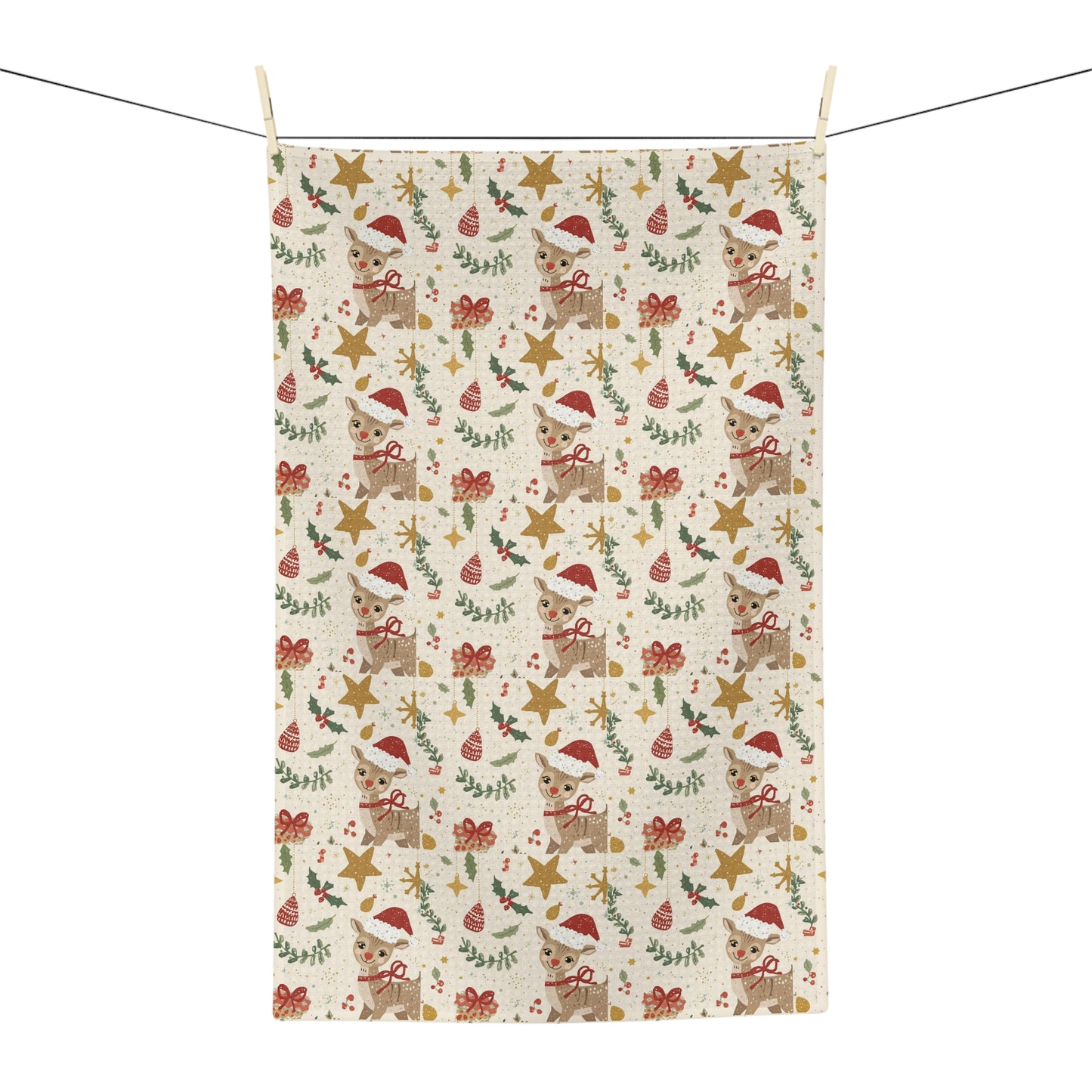 Christmas-themed fabric kitchen towel with reindeer, stars, and bows on a white background