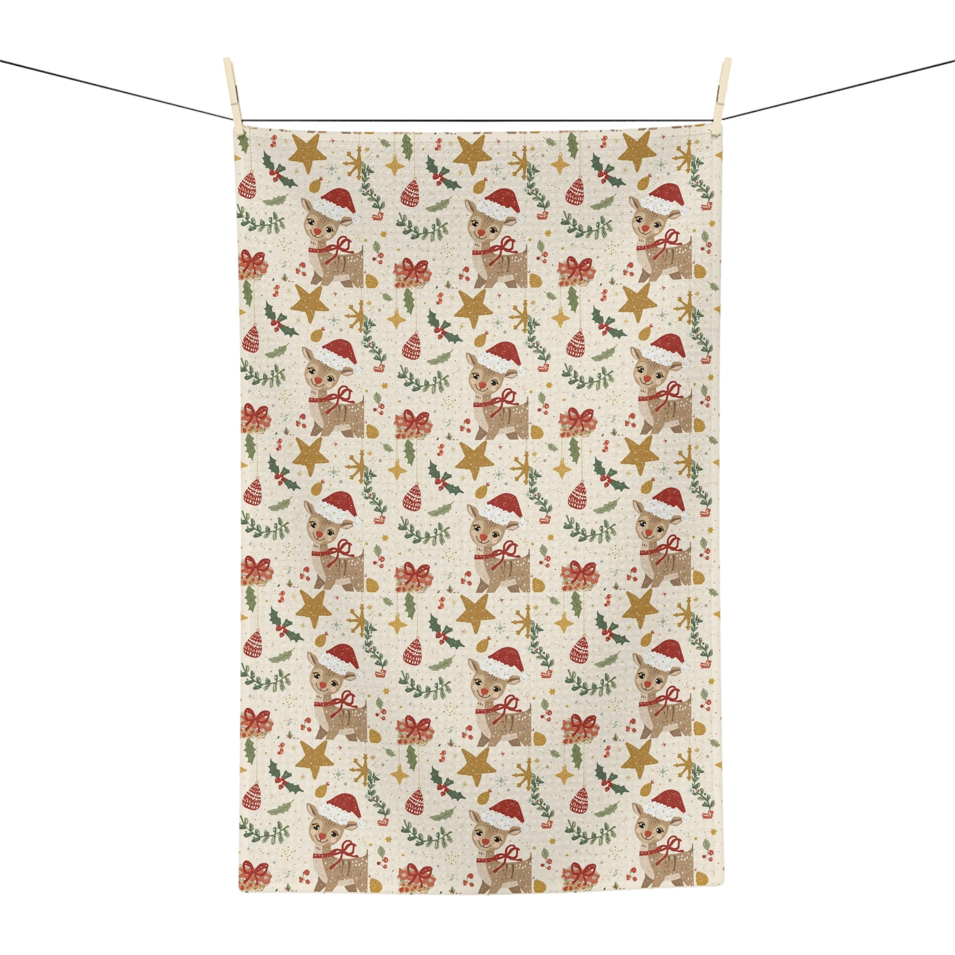 Christmas-themed fabric kitchen towel with reindeer, stars, and bows on a white background