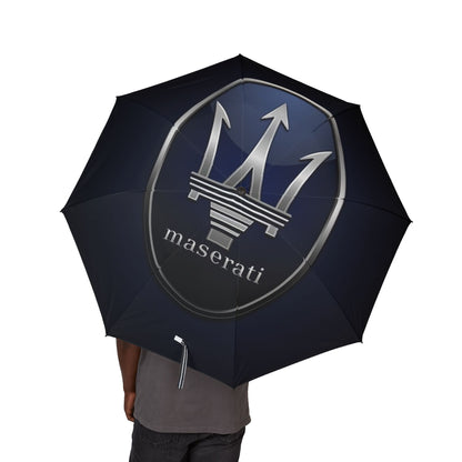 Black Maserati umbrella held by a person on a white background