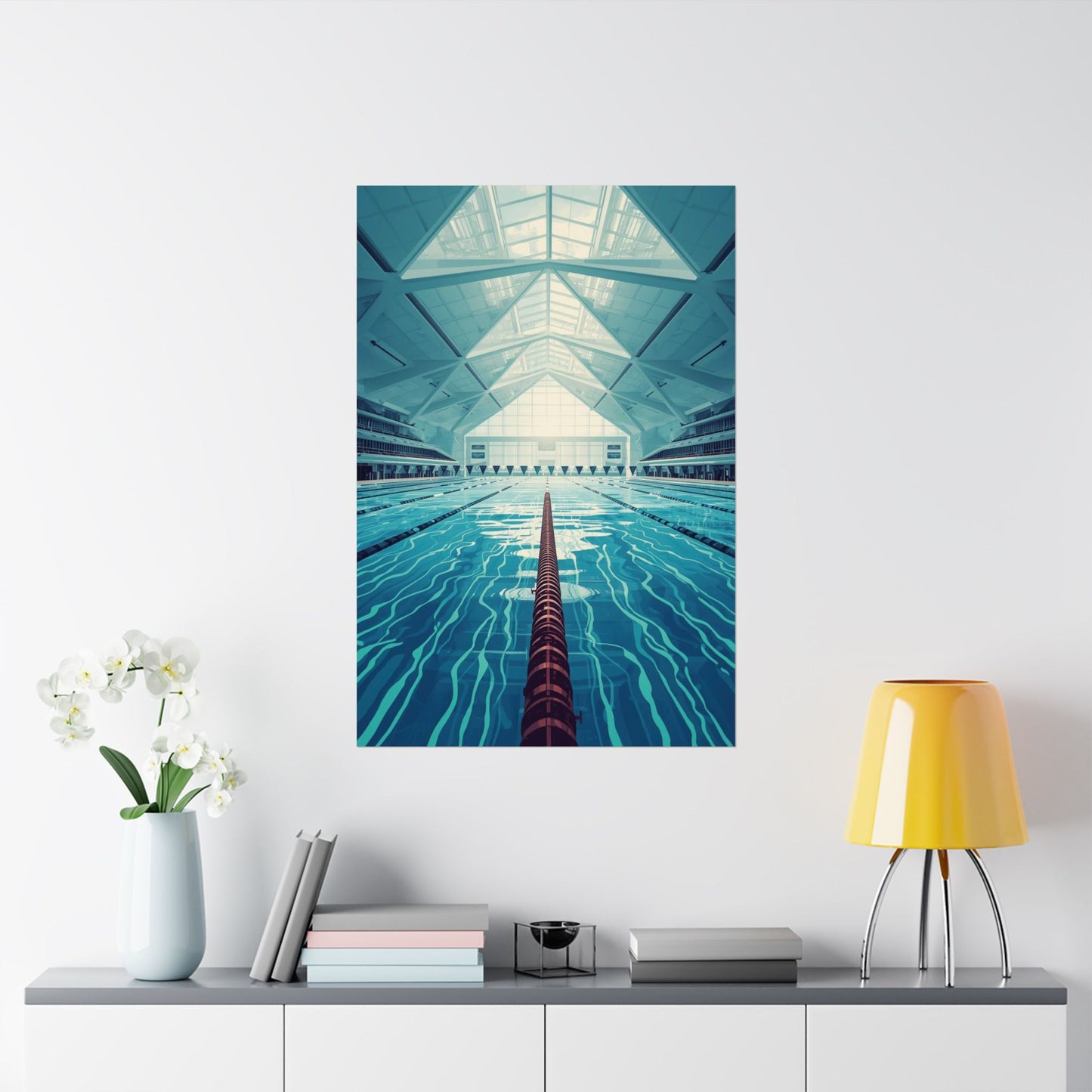 Art print of a pool with geometric ceiling on a white wall above a shelf with decor items.