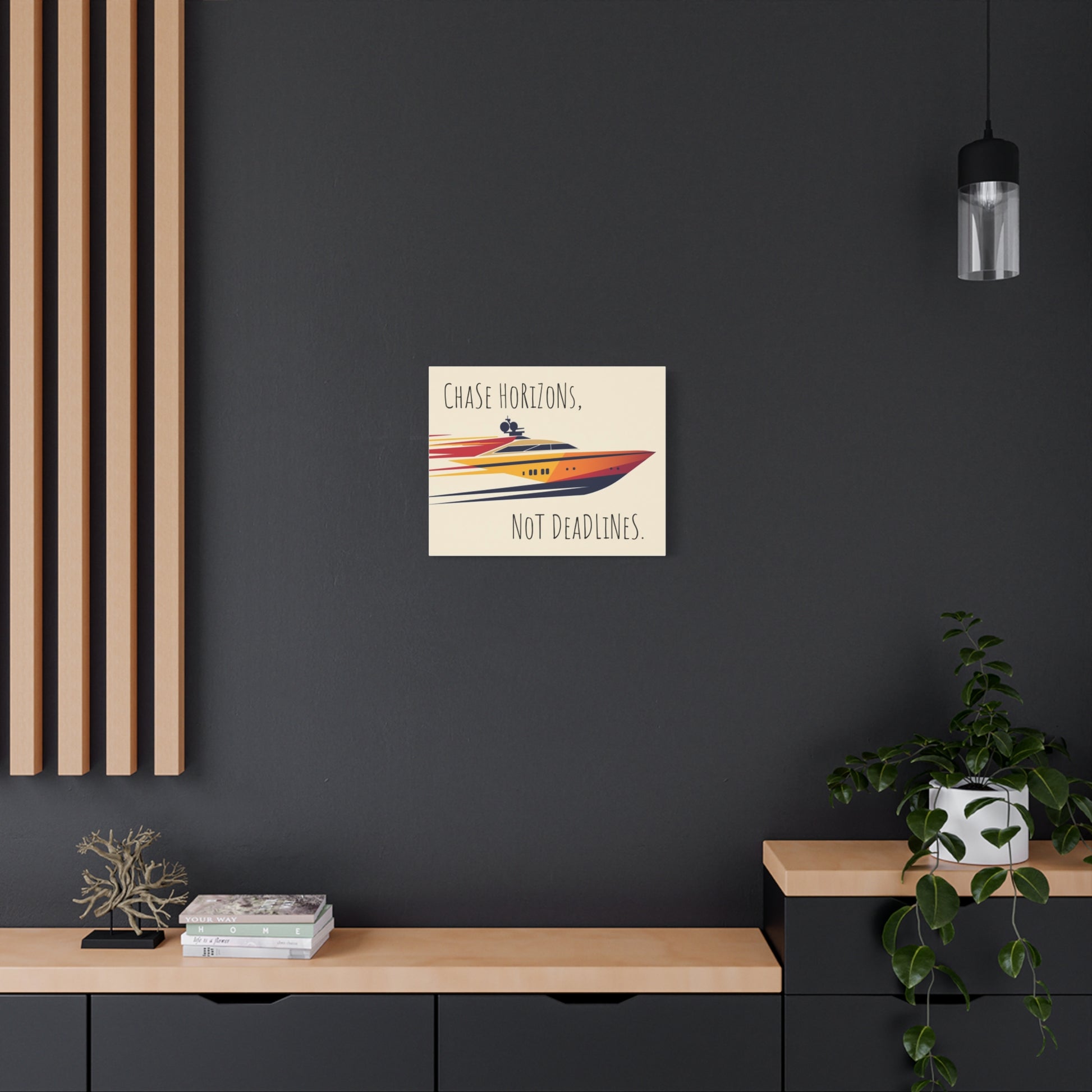 Framed poster with a motivational quote on a dark wall above a wooden shelf.