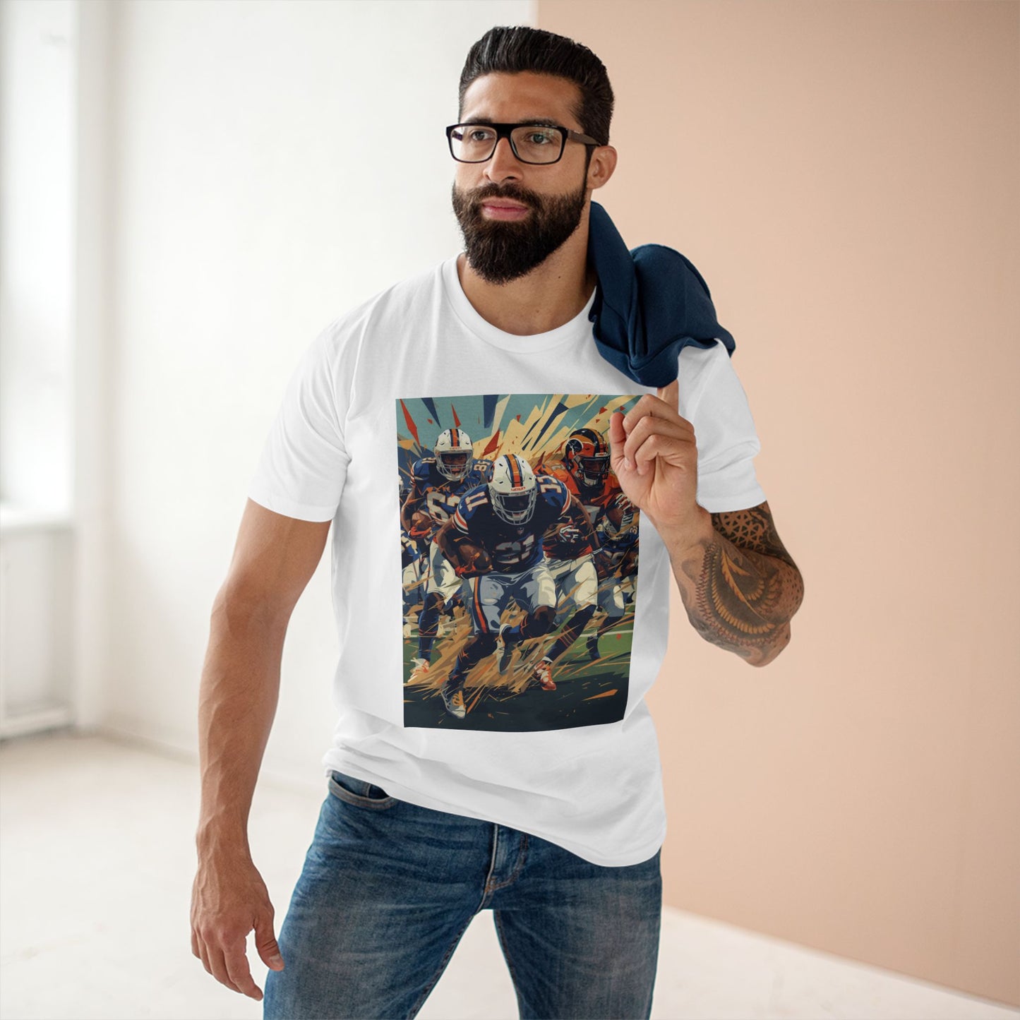 Man wearing a white t-shirt with a graphic design of a football player, standing indoors.
