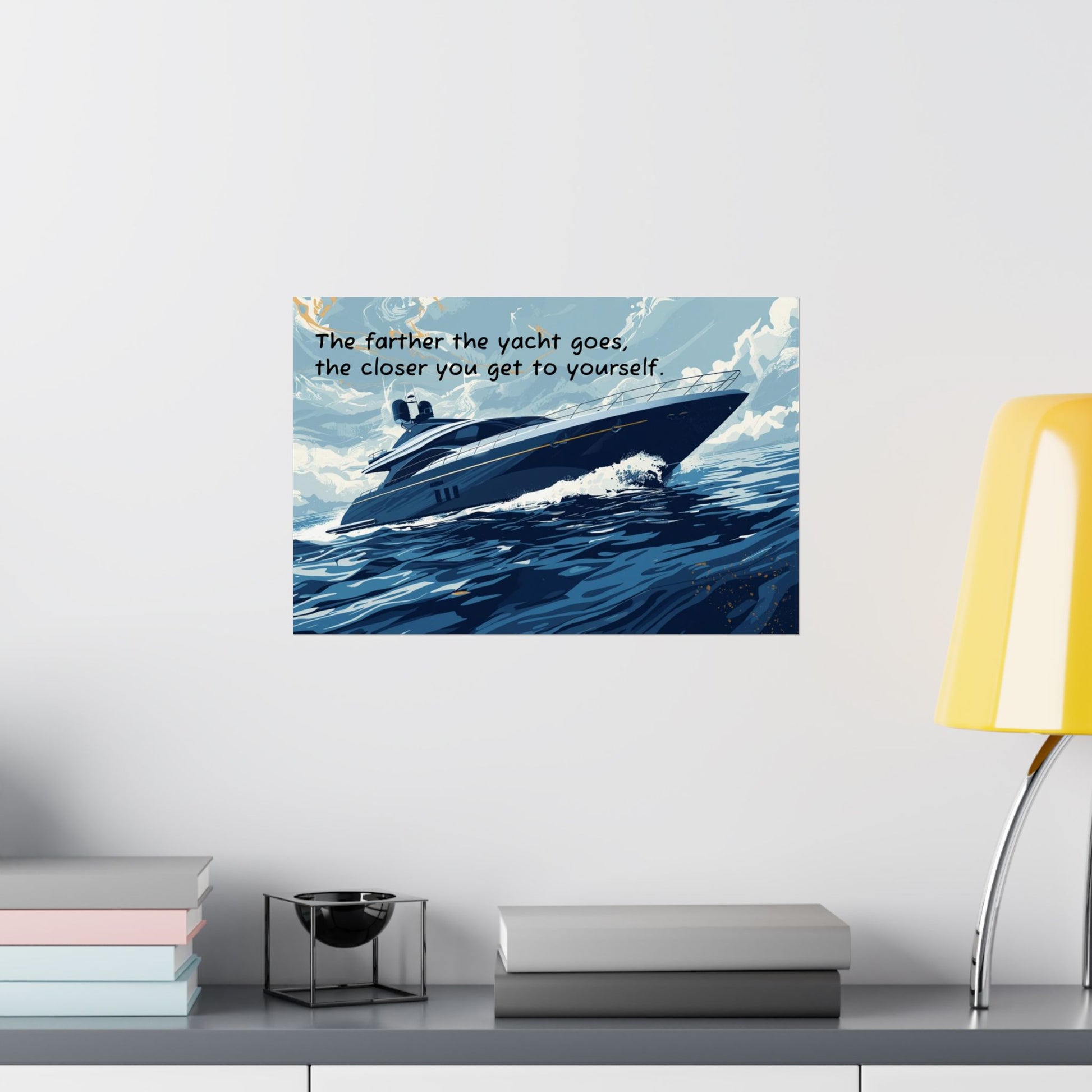 Poster of a yacht on water with a motivational quote above it, displayed on a wall.
