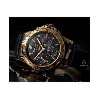 Luxury watch with gold and black design on a dark background