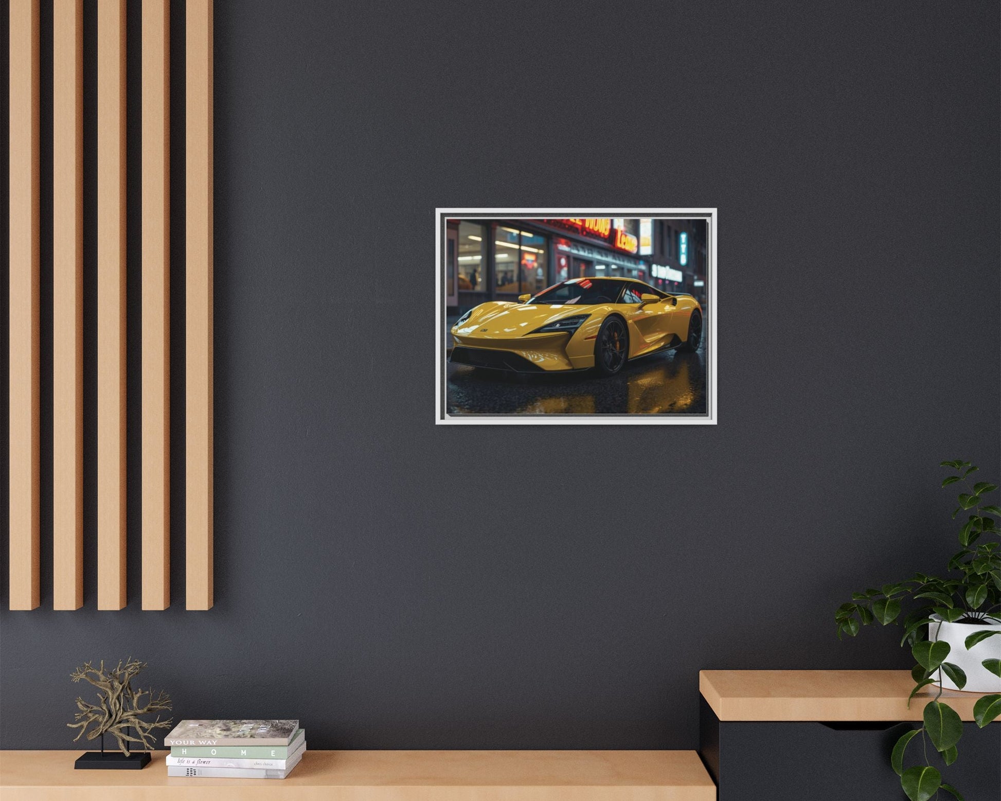 Framed artwork of a yellow sports car on a dark wall with wooden shelves below.