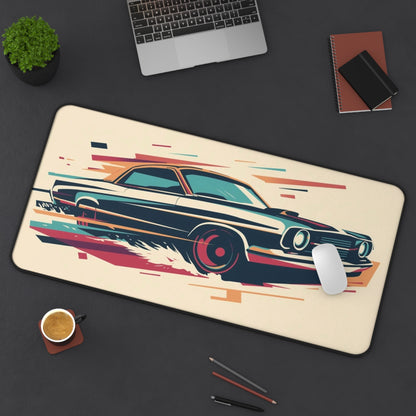 Mouse pad with car design on a desk with laptop, cup, and pens.