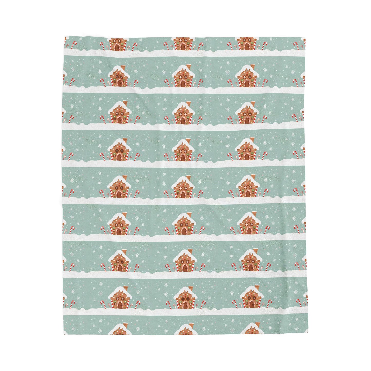 Patterned blanket with gingerbread houses on a light blue background