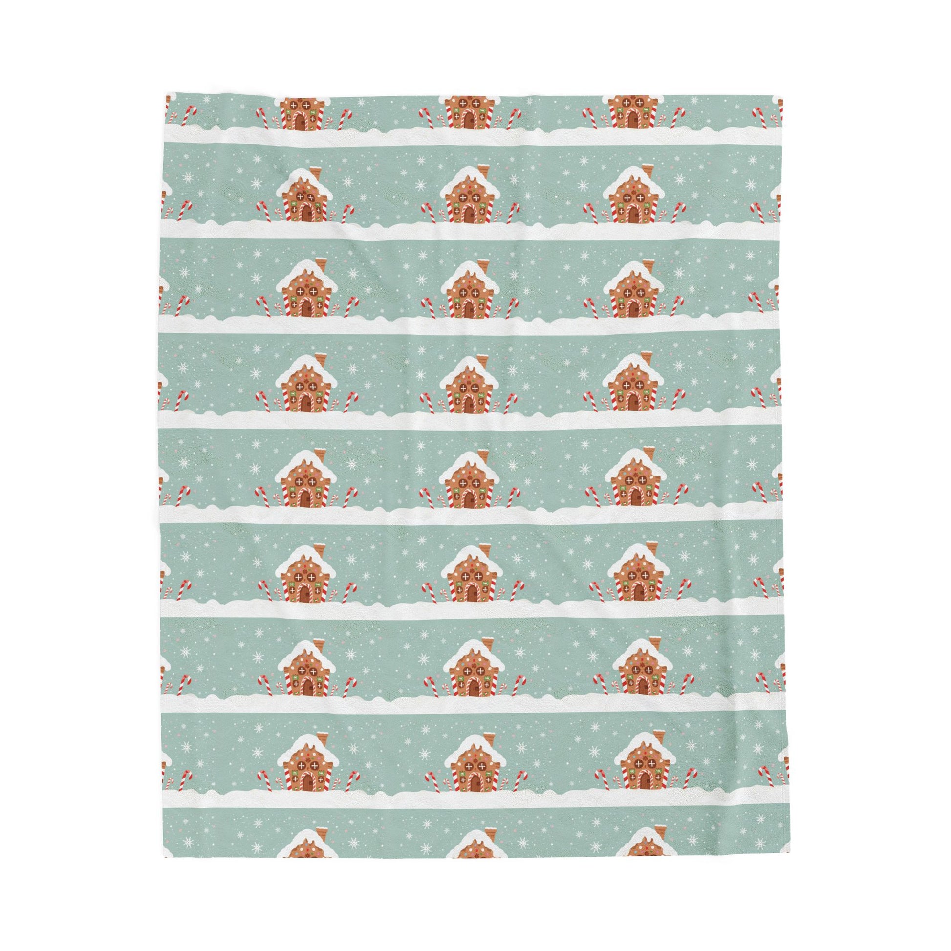 Patterned blanket with gingerbread houses on a light blue background