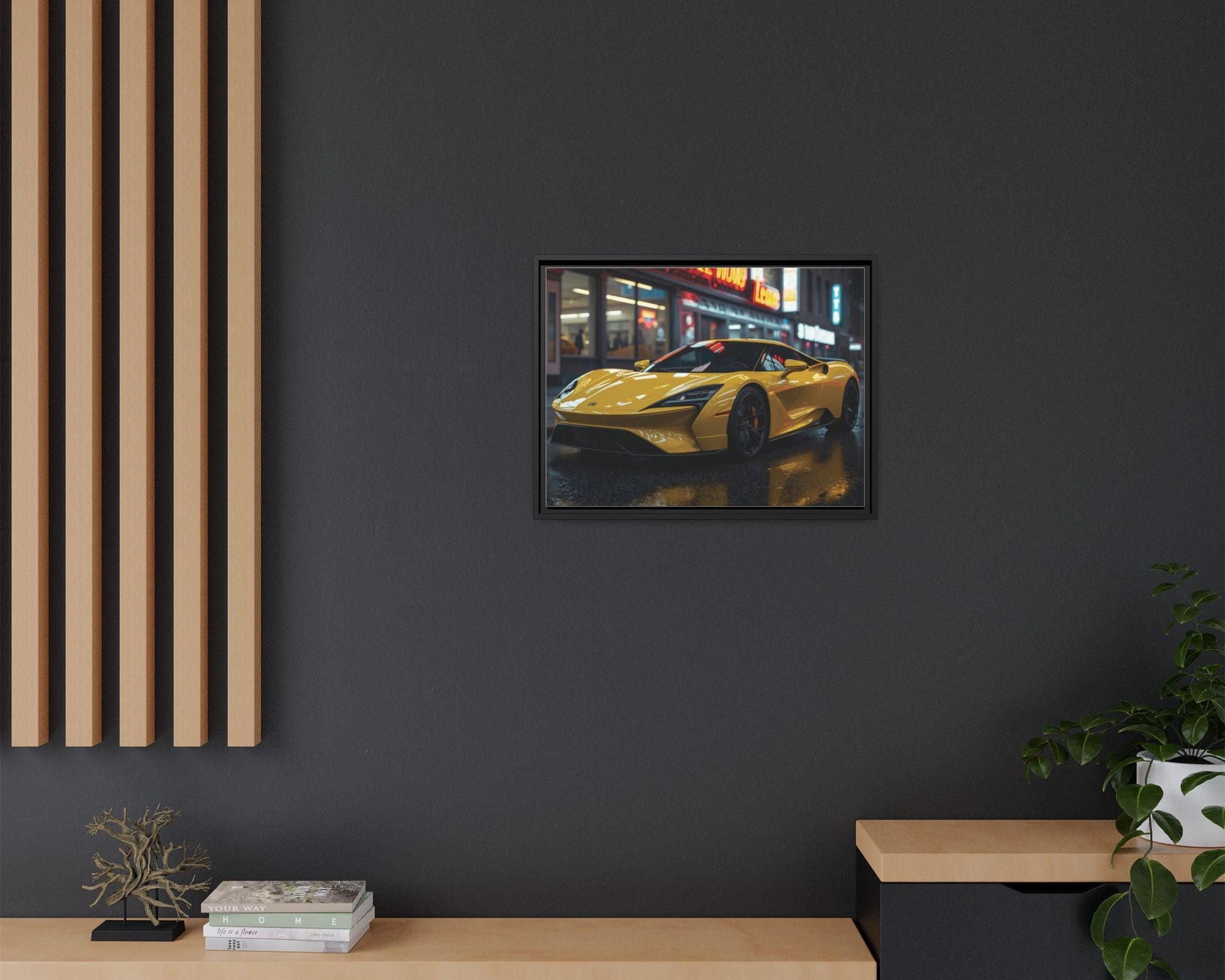 Framed artwork of a yellow sports car on a dark wall with wooden furniture and plants.