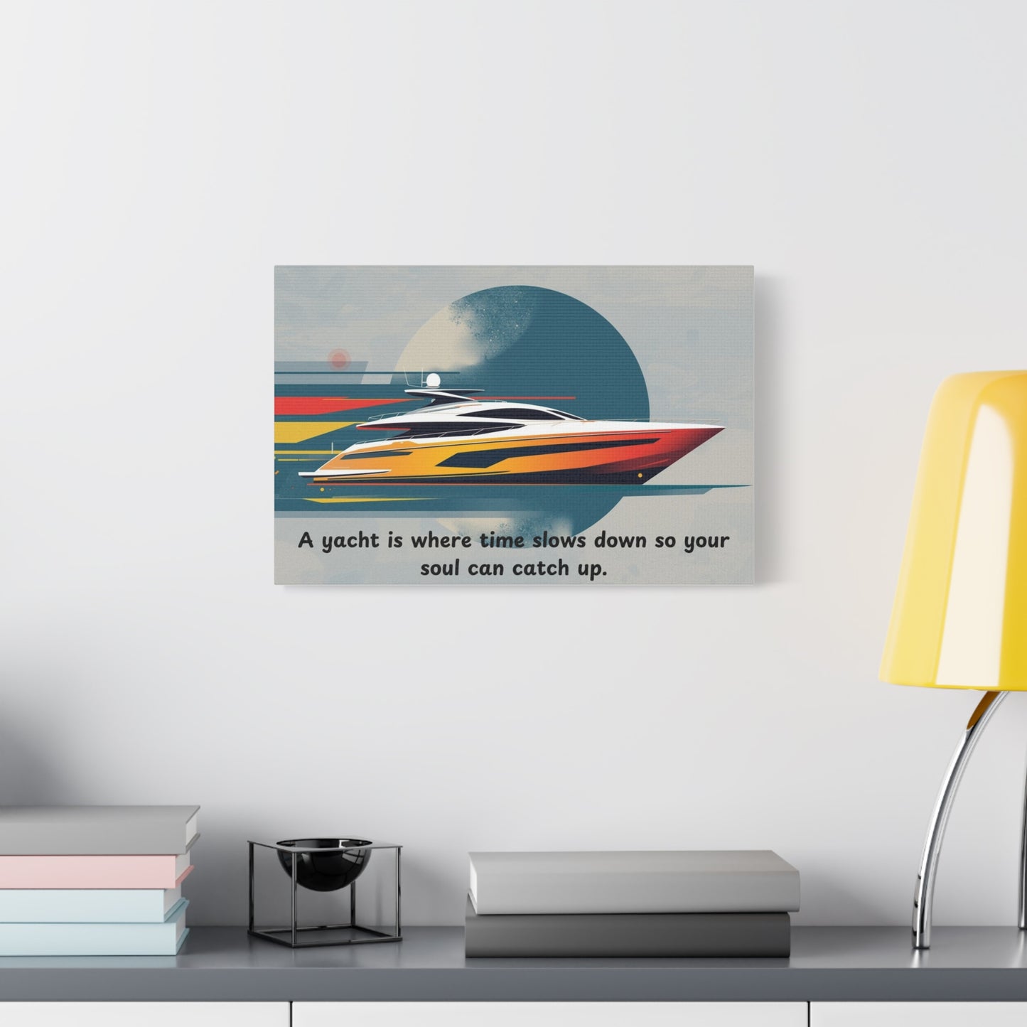 Canvas wall art with a yacht design and text on a wall above a desk.