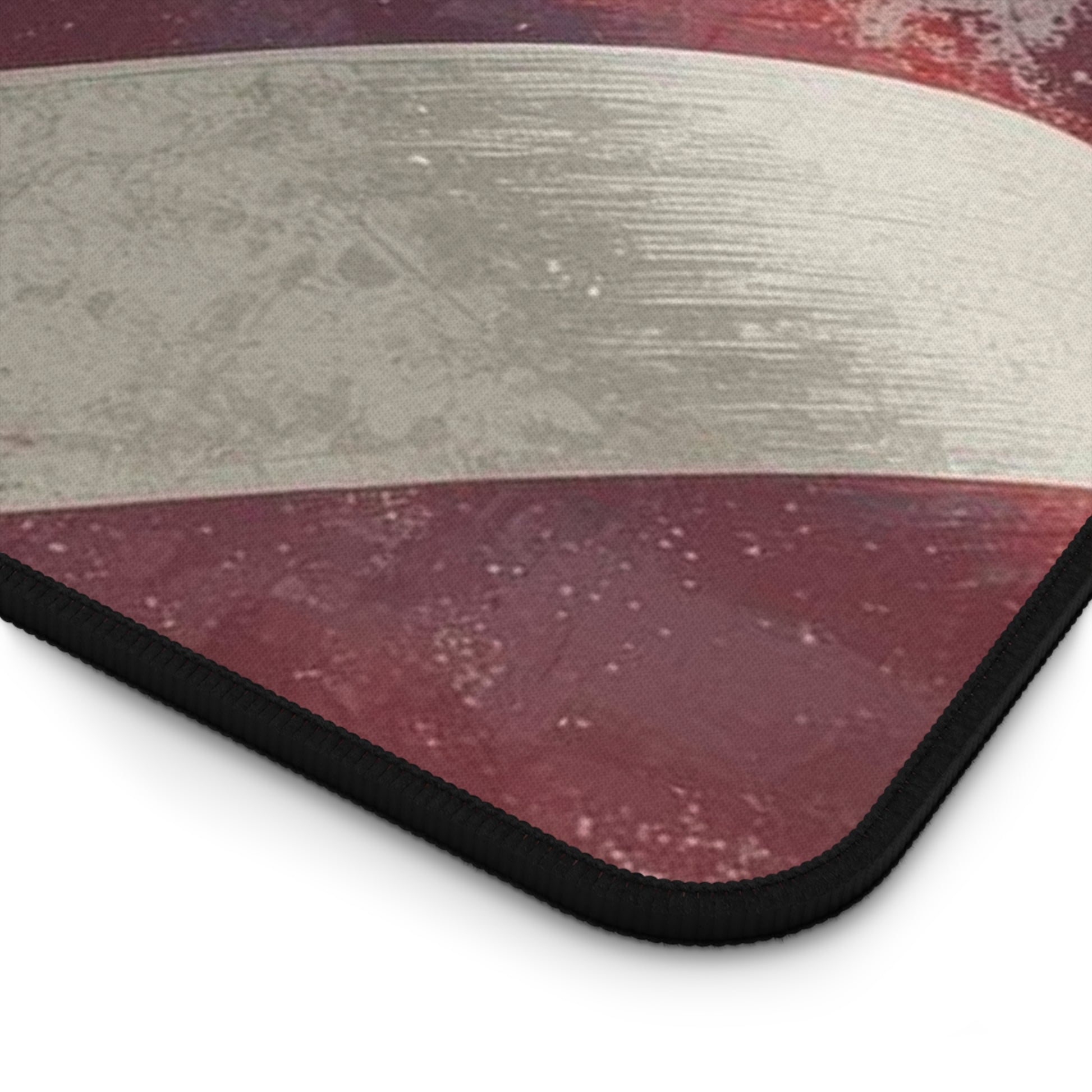 Close-up of a textured red and gray rug corner